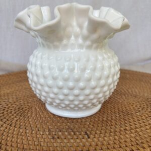 White hobnail milk glass vase with ruffled edge.