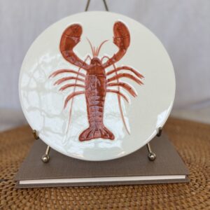 Decorative plate featuring a detailed lobster illustration in red hues.