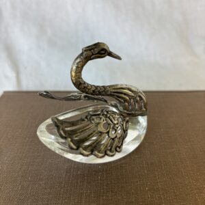 Decorative swan-shaped silver dish with intricate detailing.